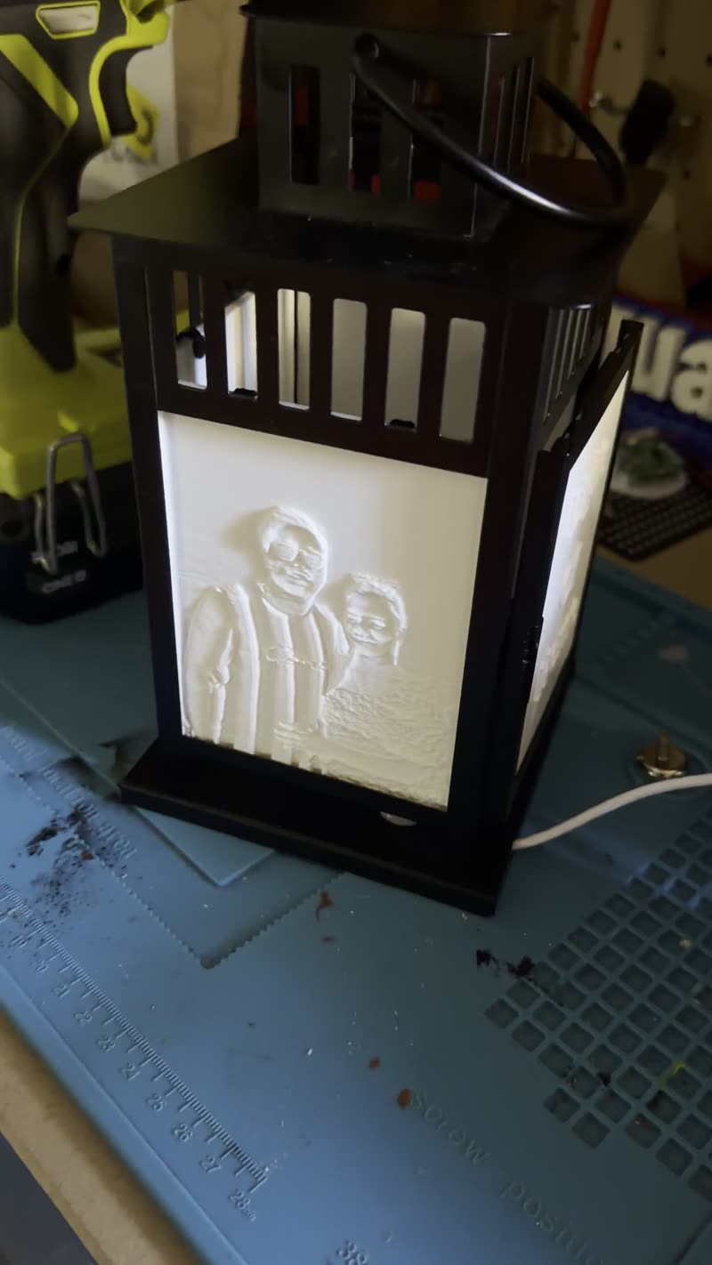 Black lantern, couple, warm light